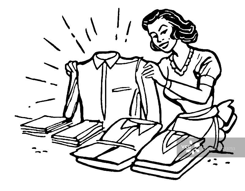 叠衣服的女人图片素材