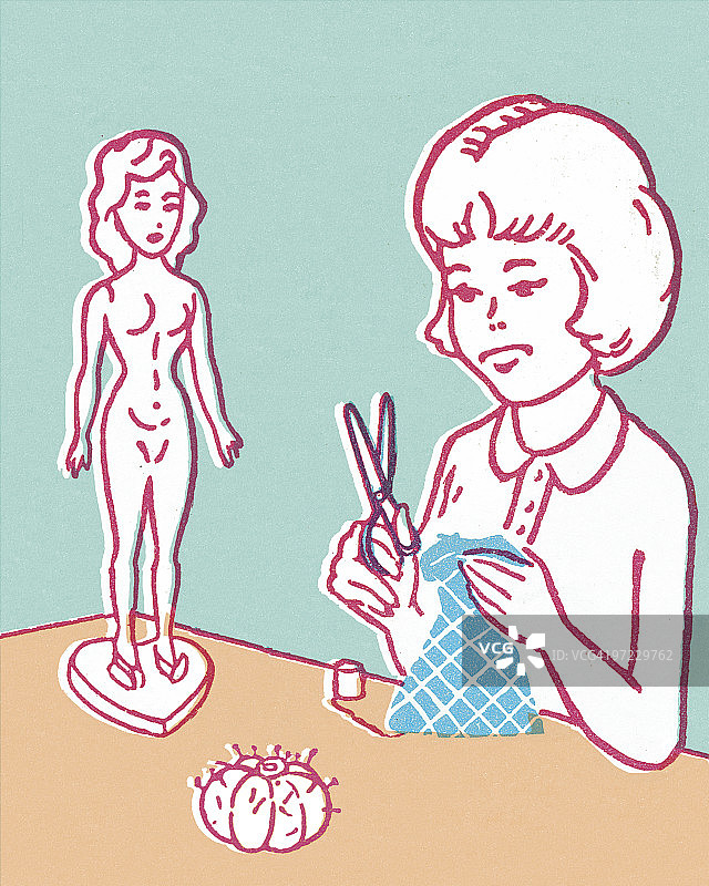 女孩为娃娃做衣服图片素材