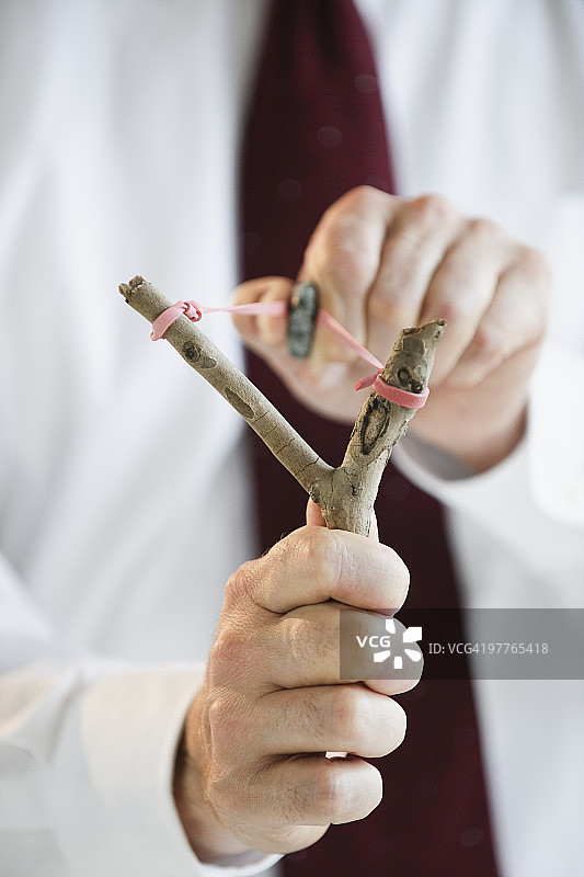 用弹弓的商人图片素材