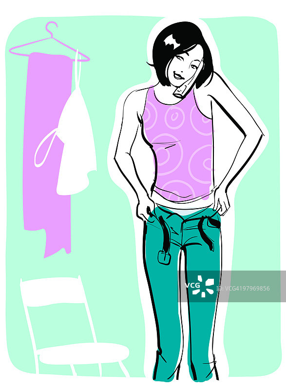 试穿裤子并用手机交谈的女人图片素材