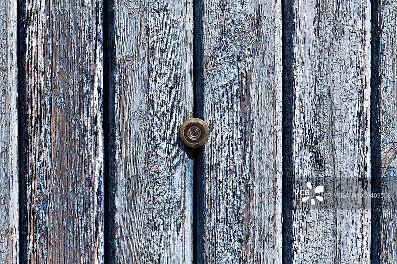 旧木纹上的门镜猫眼图片素材