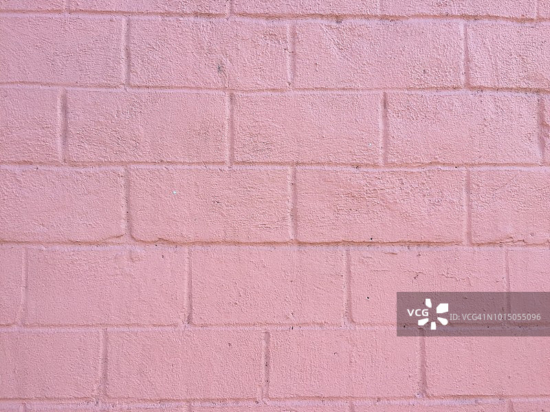 粉刷成粉色的砖墙表面图片素材