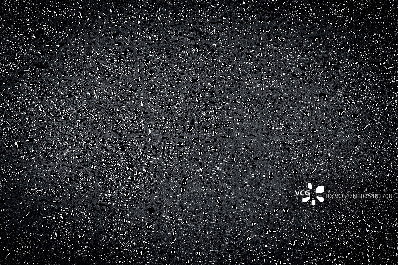 深色石材表面的水滴纹理背景图片素材