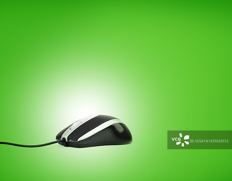 绿色背景上的电脑鼠标图片素材