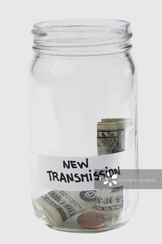 罐子里的美元钞票和硬币图片素材