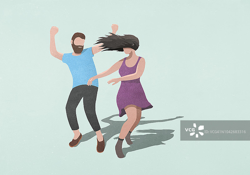 蓝色背景下无忧跳舞的情侣图片素材