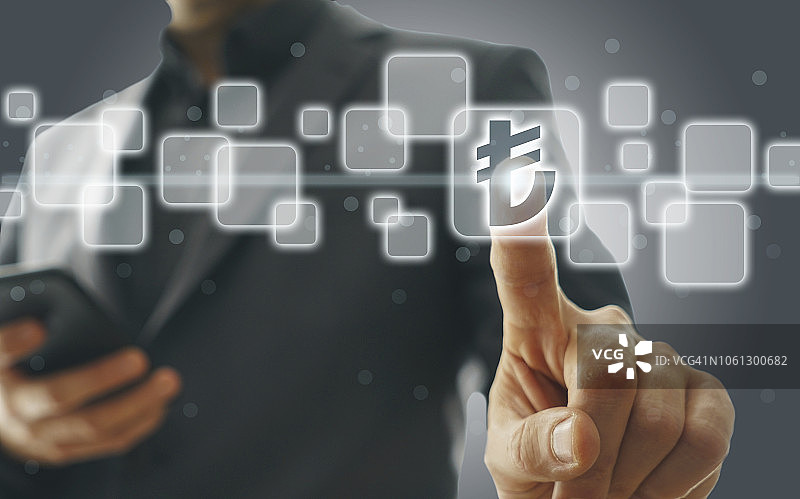 商务男士按土耳其里拉符号图片素材