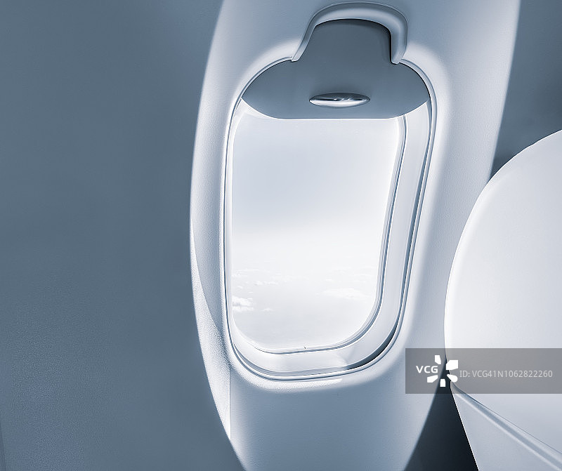 透过飞机舷窗看天空图片素材