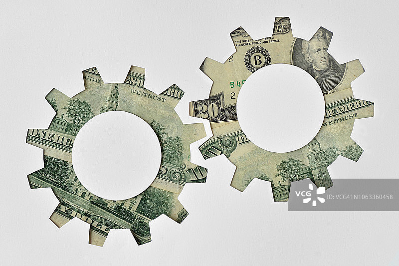 由美元纸币制成的齿轮 - 金融系统概念图片素材