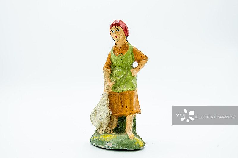 白色背景下的基督教耶稣诞生场景人物：抱鸭子的妇女图片素材