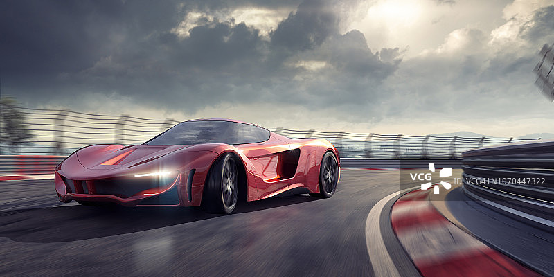 红色跑车在赛道弯道行驶图片素材