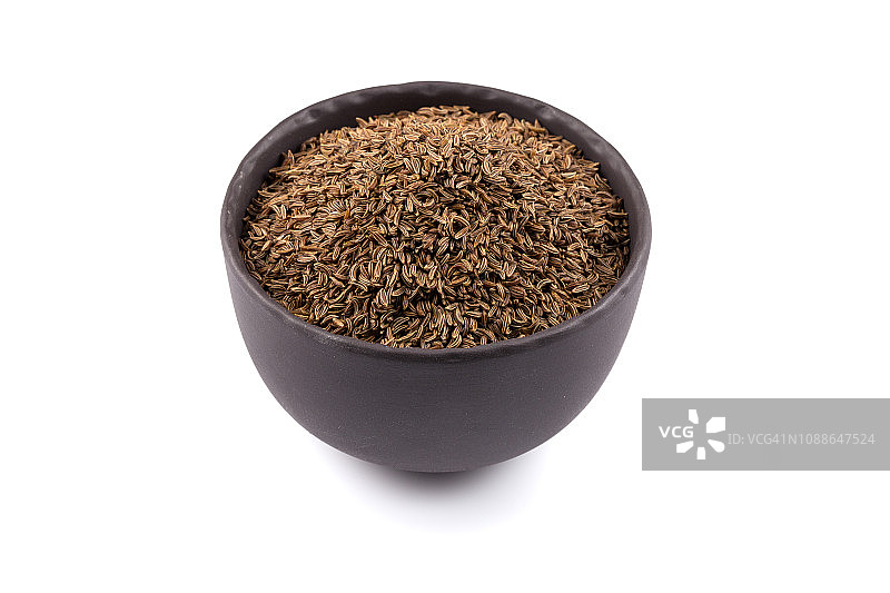 石碗与孜然籽堆图片素材