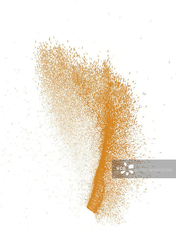 白色背景上橙色粉末颗粒碰撞产生的爆炸图片素材
