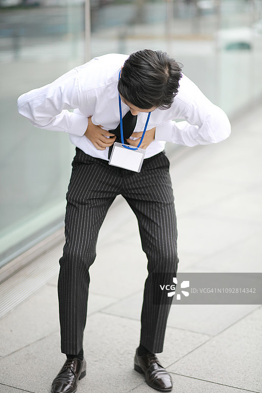 肚子疼的商人图片素材