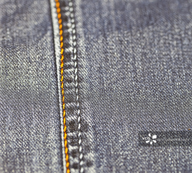 牛仔裤背景全画幅照片，牛仔裤缝线图片素材