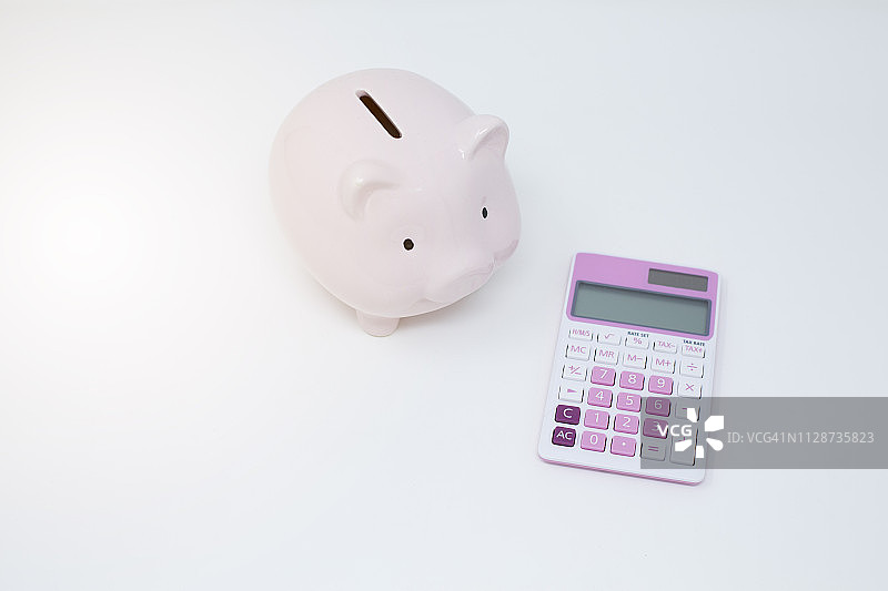 储蓄罐和计算器图片素材