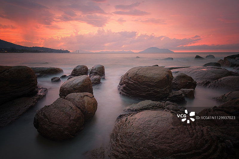 印度尼西亚山口洋龟岛海滩日落长曝光图片素材