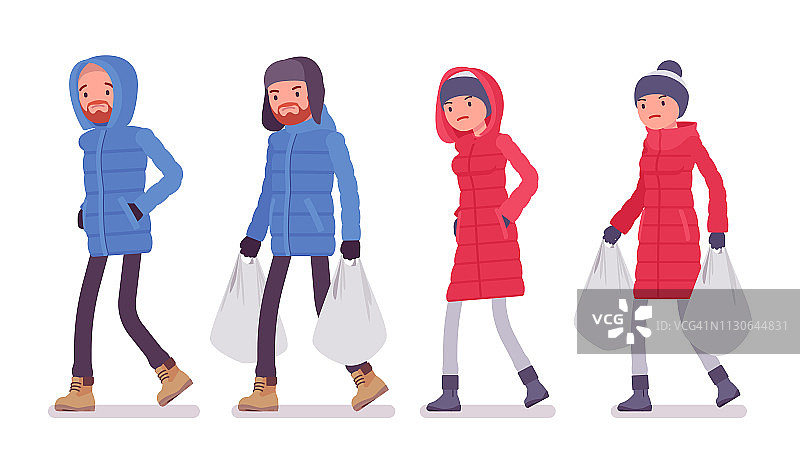 穿着羽绒服，提着沉重购物袋的男人和女人图片素材