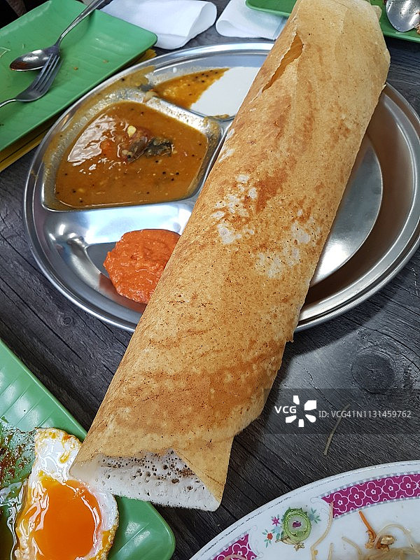 印度煎饼Dosa，Tosai或Thosai配咖喱图片素材