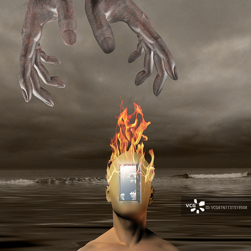 黑暗海洋背景下燃烧的人头图片素材