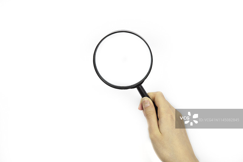 在白色背景上用放大镜观察图片素材