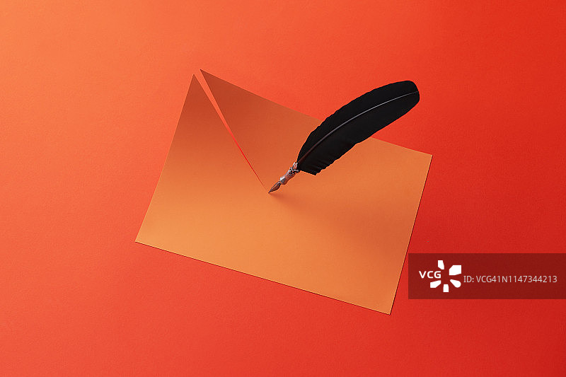 鹅毛笔切纸红色背景图片素材