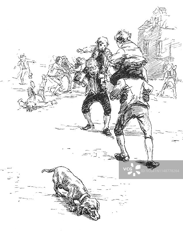 男孩们和腊肠犬玩耍图片素材