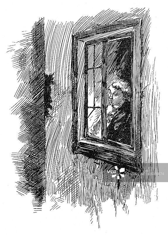 在窗户后面向外看的年轻人图片素材