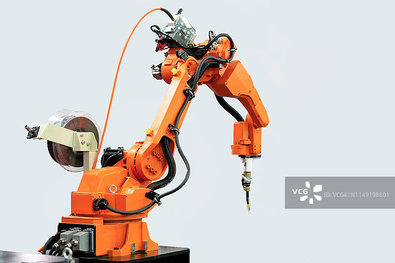 孤立背景下的机械臂电机。机械手。工业机器人操纵器。现代工业技术。焊接概念。图片素材