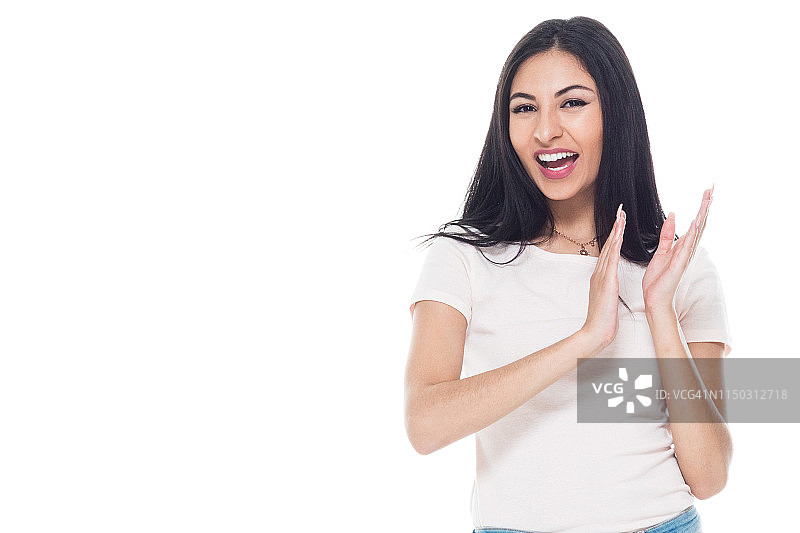 长发牛仔裤的可爱拉丁裔女子 - 鼓掌图片素材