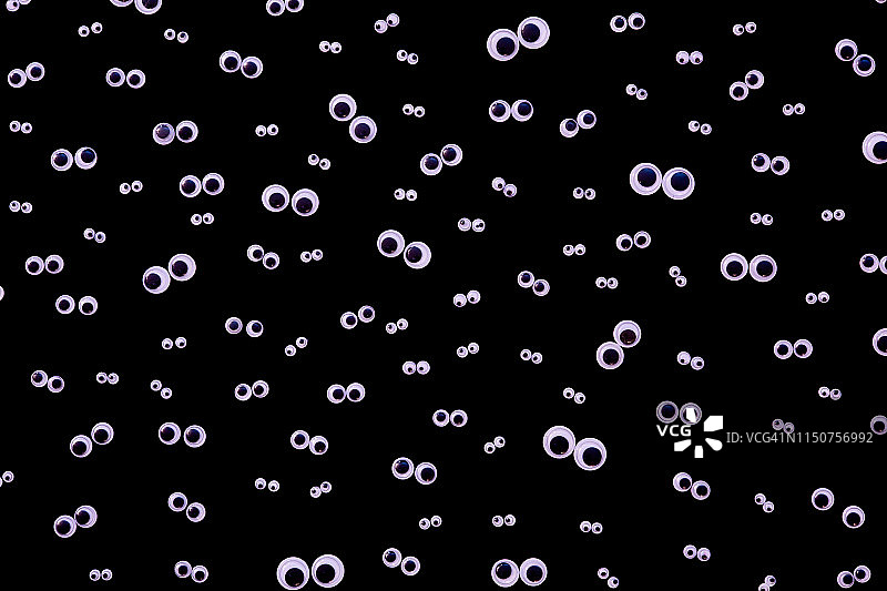 黑色背景上的大量卡通眼睛图片素材