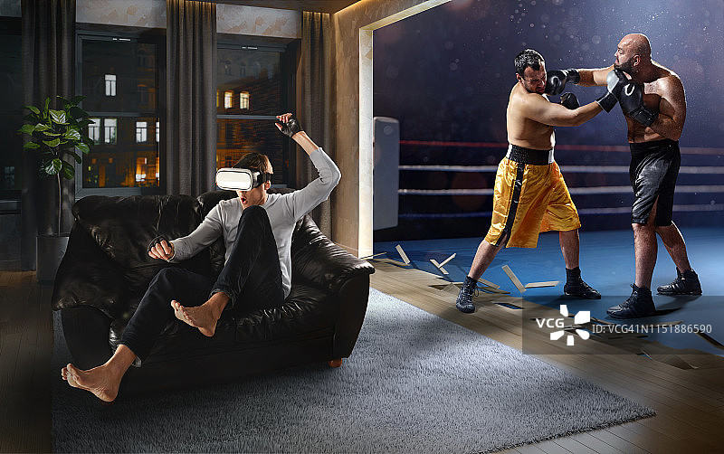 戴VR眼镜进行拳击的男人图片素材