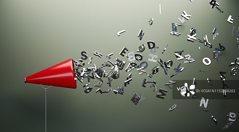 灰色墙前的红色扩音器和银色字母图片素材