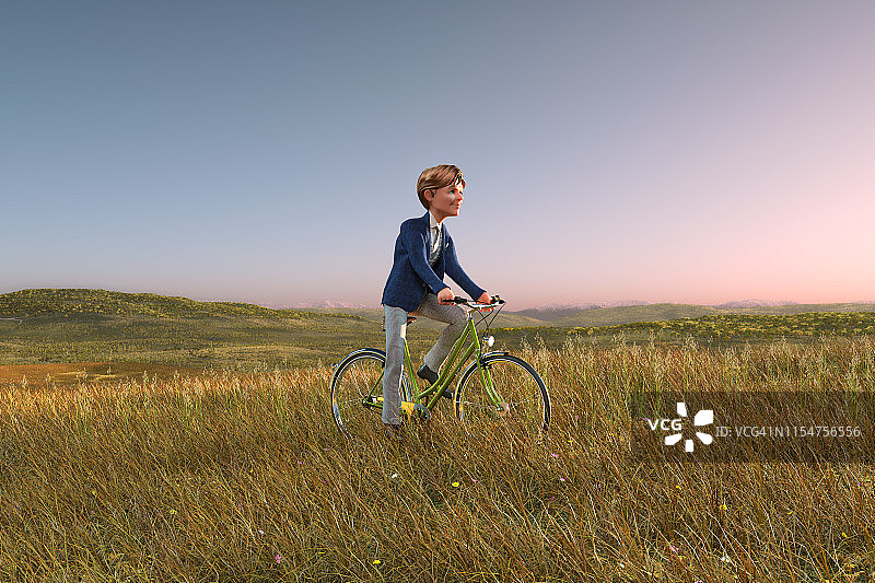 在日出草地上骑自行车的商人图片素材