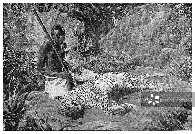 猎人与死去的豹子图片素材