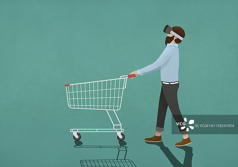 使用虚拟现实模拟器推购物车的男子图片素材