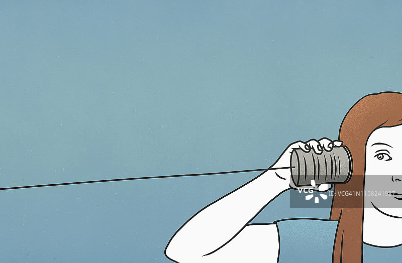 女人在听锡罐电话图片素材