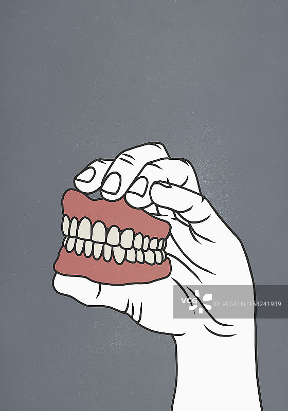 手拿假牙图片素材