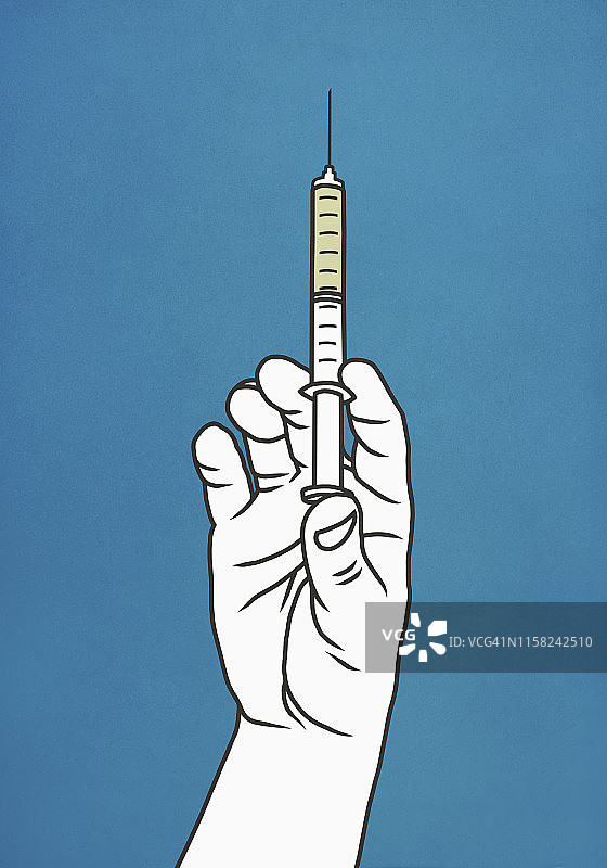 拿着注射器的手图片素材