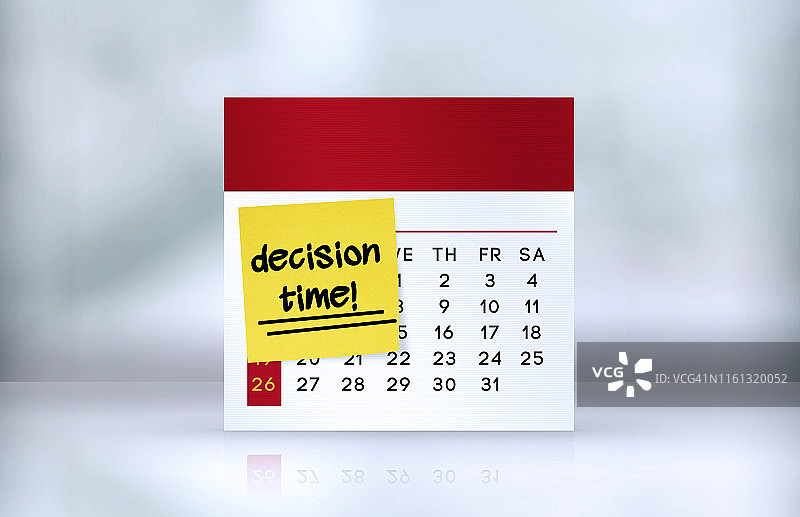 办公桌日历上的决策时间提醒便签图片素材