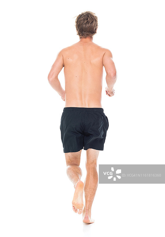 穿着运动服跑步的健壮赤膊男子图片素材