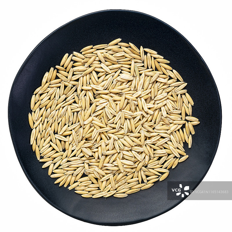 黑盘中的燕麦米图片素材