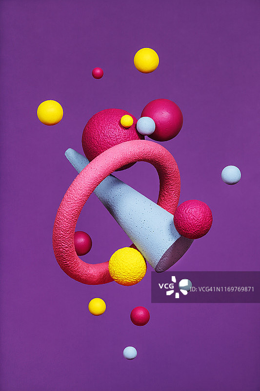 紫色背景上的抽象多色物体图片素材