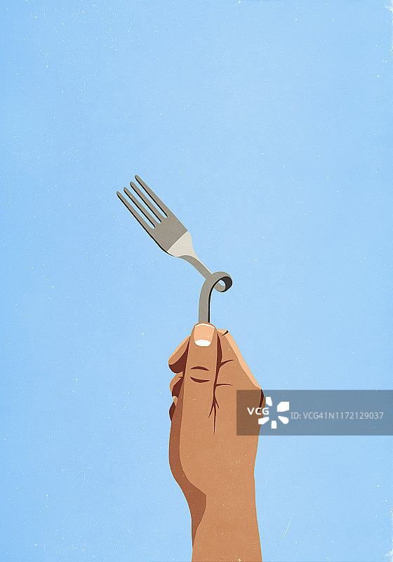 手持弯曲的叉子图片素材