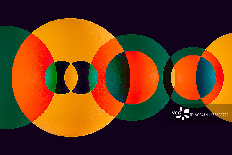 绿色和橙色重叠圆圈图片素材