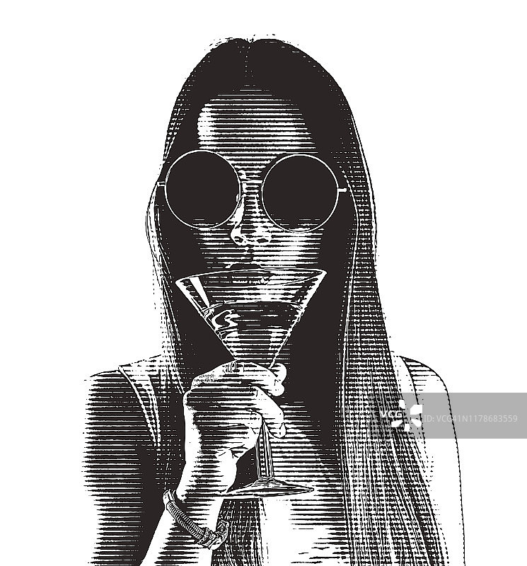 饮用马提尼的美丽年轻女人图片素材