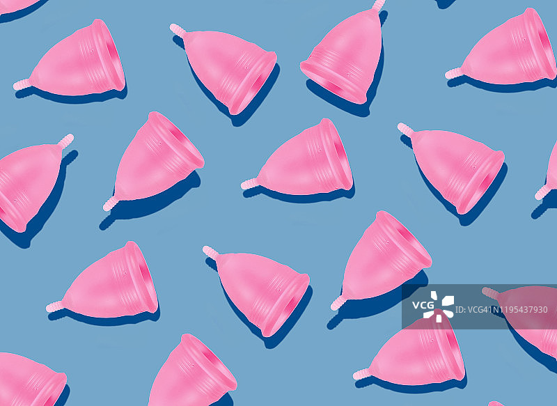 环保可重复使用粉色月经杯蓝色背景图案图片素材