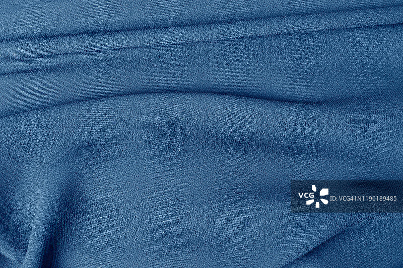 蓝色面料折叠，美丽的蓝色纹理，缝纫用面料图片素材