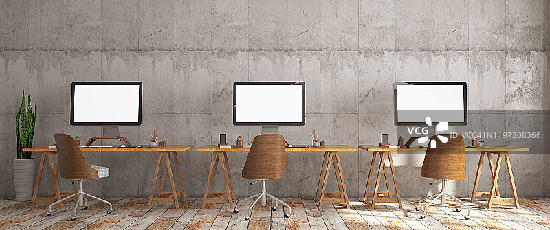 拥有三台电脑的现代商务办公室内部（宽镜头）图片素材