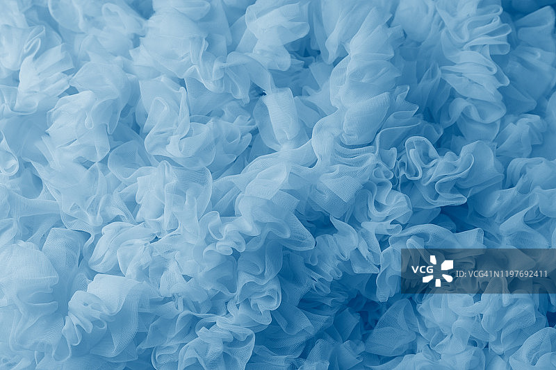 蓝色轻质网眼面料，面料纹理，优美悬垂的背景图片素材